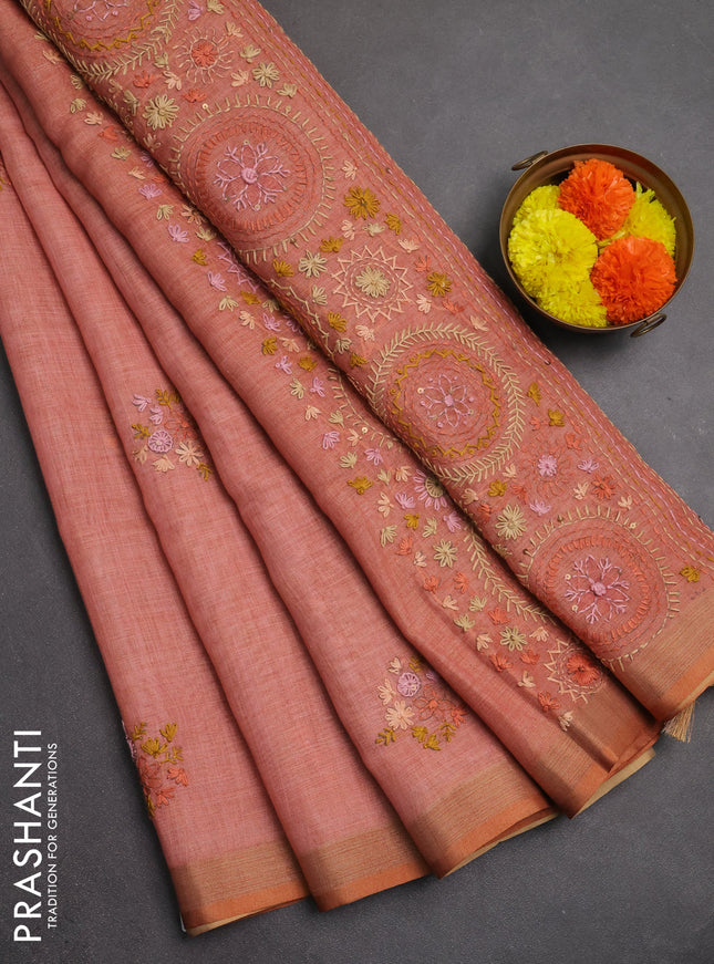 Linen saree peach shade with embroidery buttas and embroidery pallu