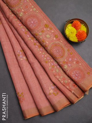 Linen saree peach shade with embroidery buttas and embroidery pallu