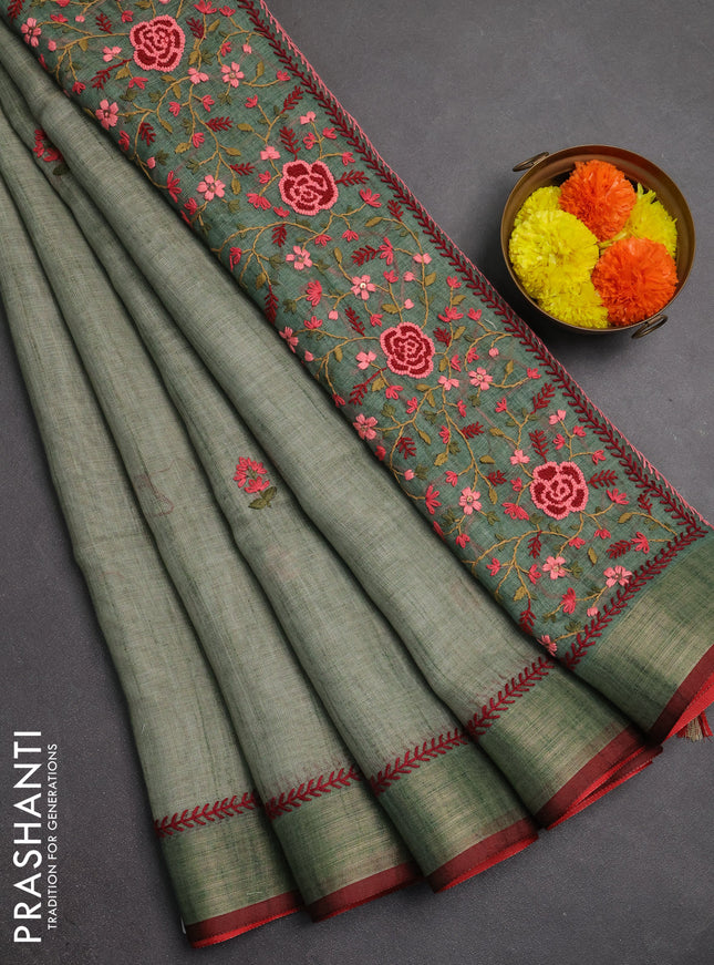Linen saree pastel green and maroon with embroidery buttas and embroidery pallu