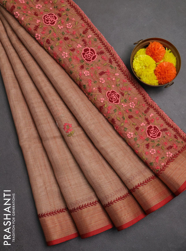 Linen saree rust shade and maroon with embroidery buttas and embroidery pallu