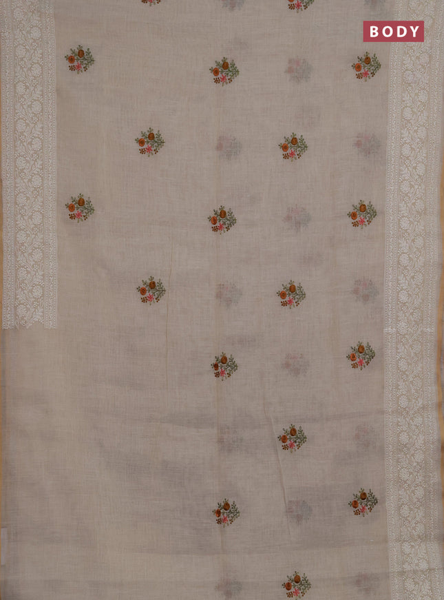 Linen saree beige with embroidery buttas and embroidery pallu