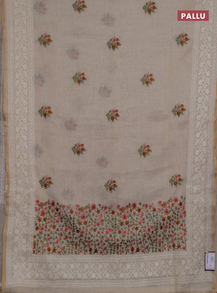 Linen saree beige with embroidery buttas and embroidery pallu
