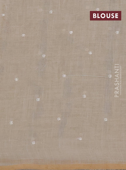 Linen saree beige with embroidery buttas and embroidery pallu