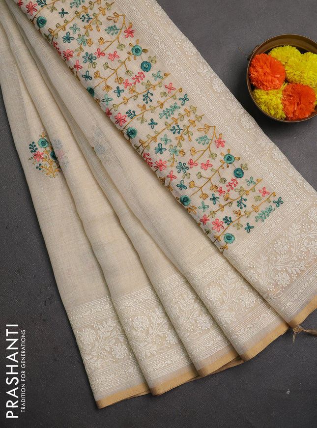 Linen saree beige and teal green with embroidery buttas and embroidery pallu