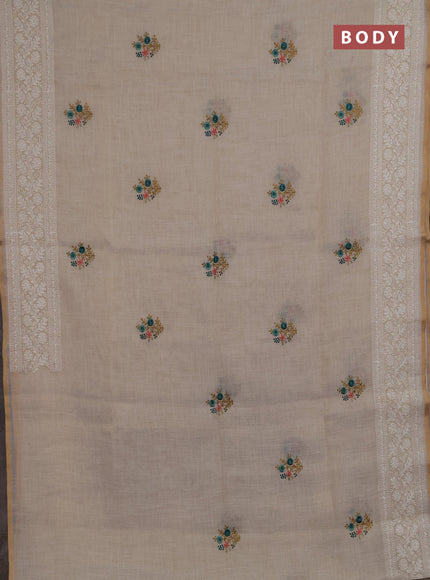 Linen saree beige and teal green with embroidery buttas and embroidery pallu