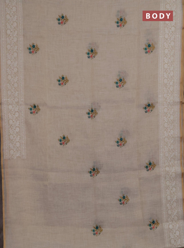 Linen saree beige and teal green with embroidery buttas and embroidery pallu