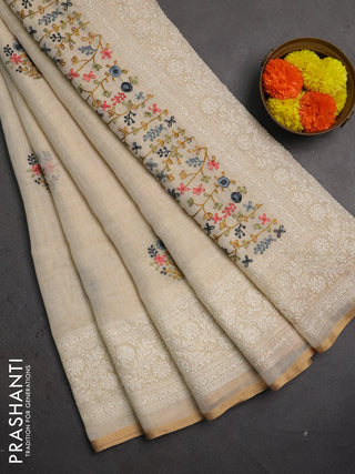 Linen saree beige and grey with embroidery buttas and embroidery pallu