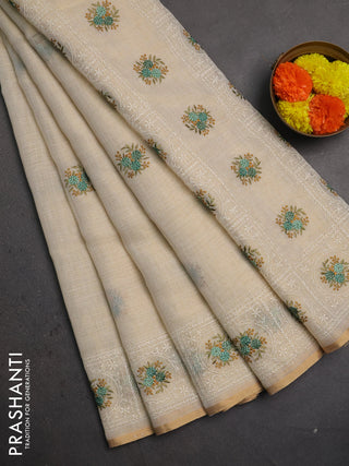 Linen saree beige and teal green with embroidery buttas and embroidery pallu