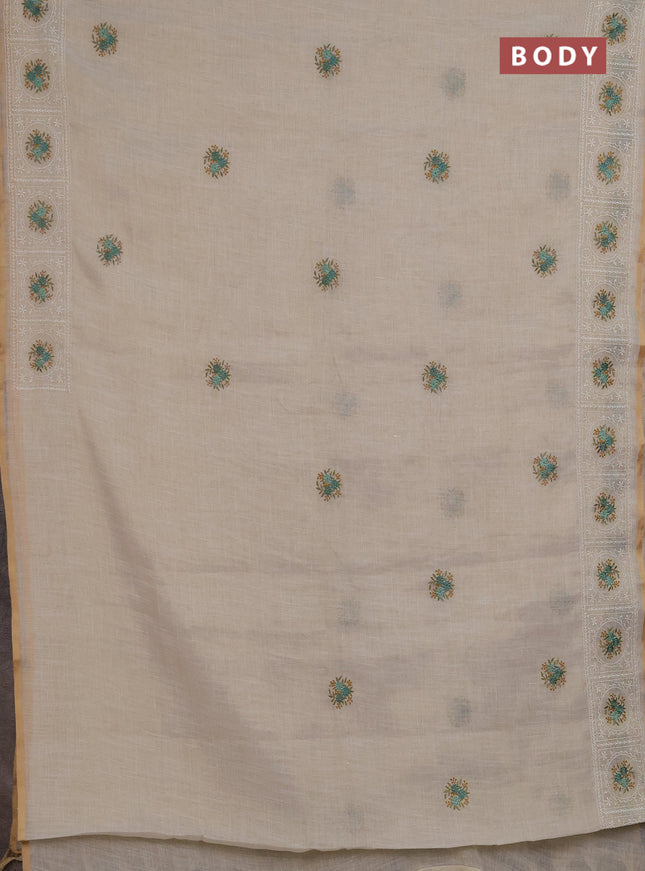 Linen saree beige and teal green with embroidery buttas and embroidery pallu