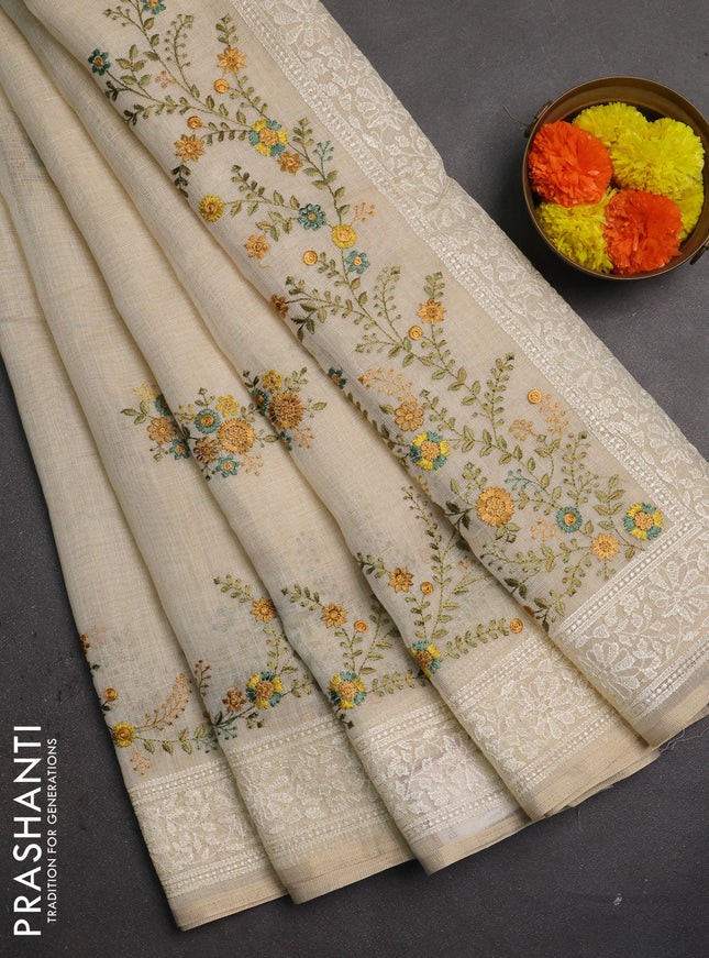 Linen saree beige and teal green with embroidery buttas and embroidery pallu & border