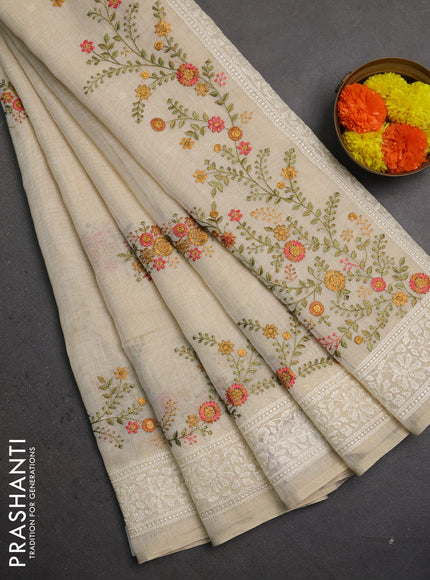 Linen saree beige and peach shade with embroidery buttas and embroidery pallu & border