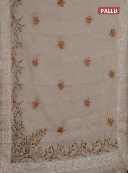 Linen saree beige and peach shade with embroidery buttas and embroidery pallu & border