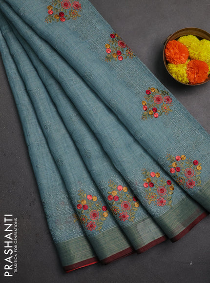 Linen saree pastel blue and maroon with allover embroidery weaves and embroidery pallu & border
