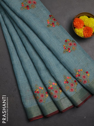 Linen saree pastel blue and maroon with allover embroidery weaves and embroidery pallu & border