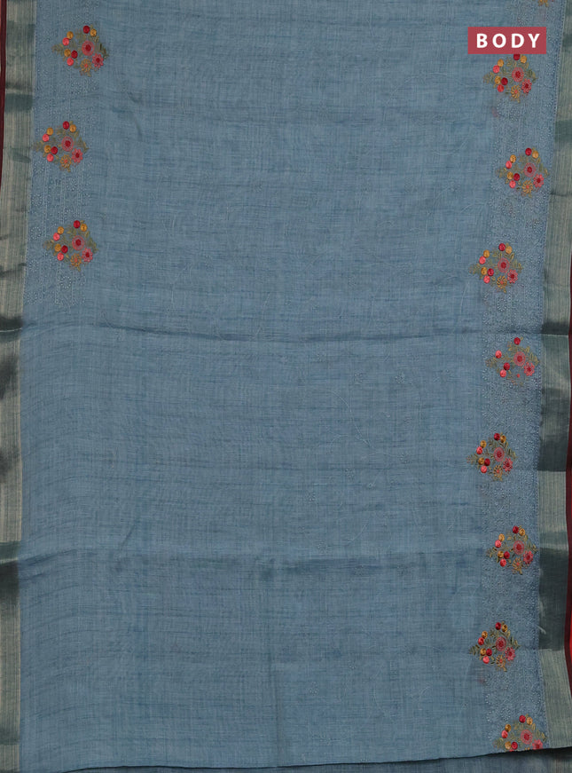 Linen saree pastel blue and maroon with allover embroidery weaves and embroidery pallu & border