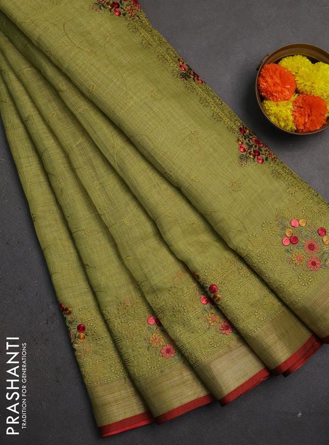 Linen saree light green and maroon with allover embroidery weaves and embroidery pallu & border