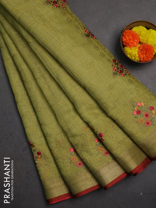 Linen saree light green and maroon with allover embroidery weaves and embroidery pallu & border