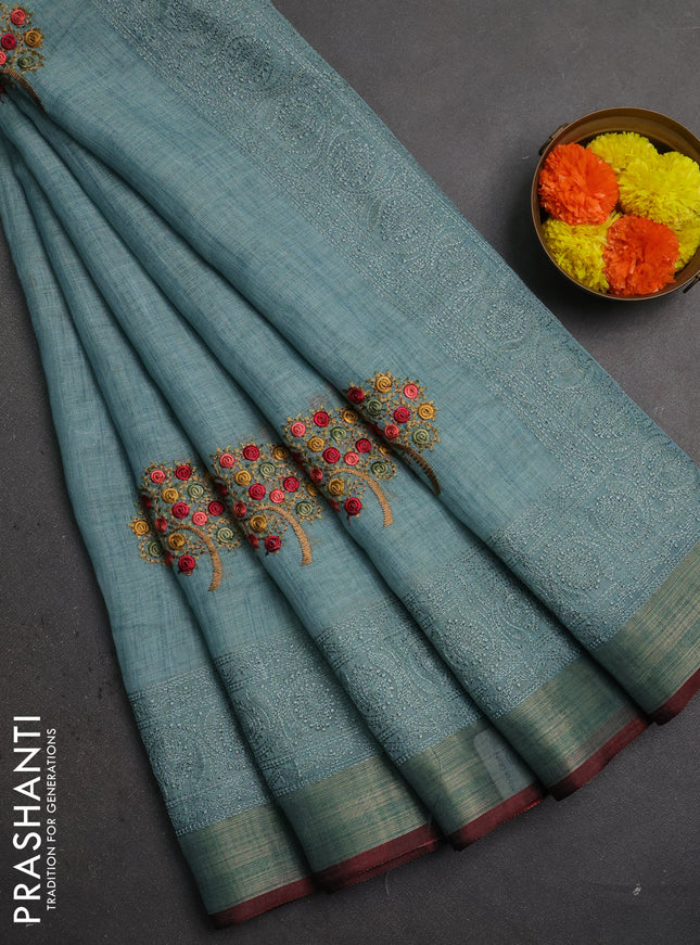 Linen saree pastel blue and maroon with embroidery buttas and embroidery pallu & border