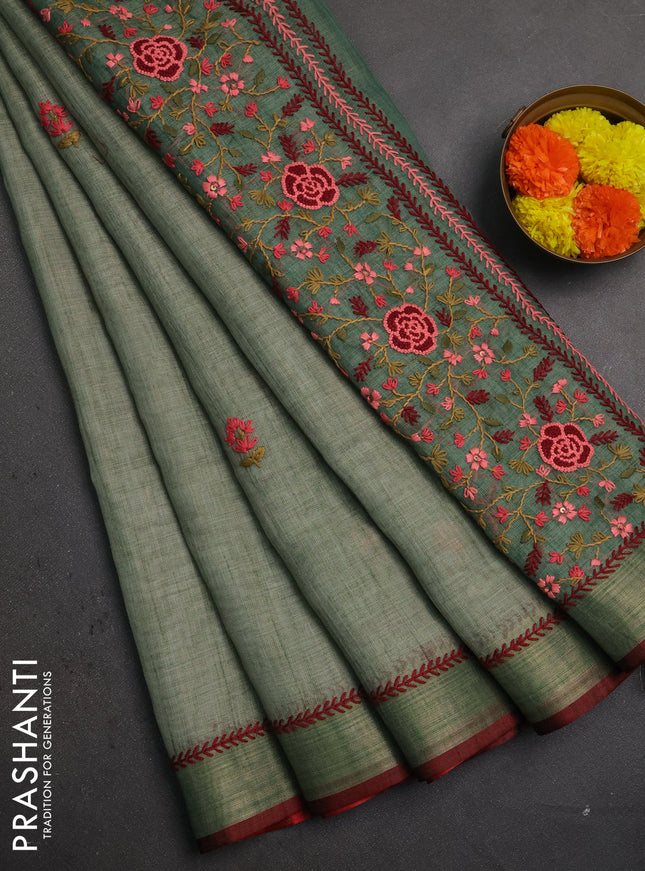 Linen saree pastel green and maroon with embroidery buttas and embroidery pallu
