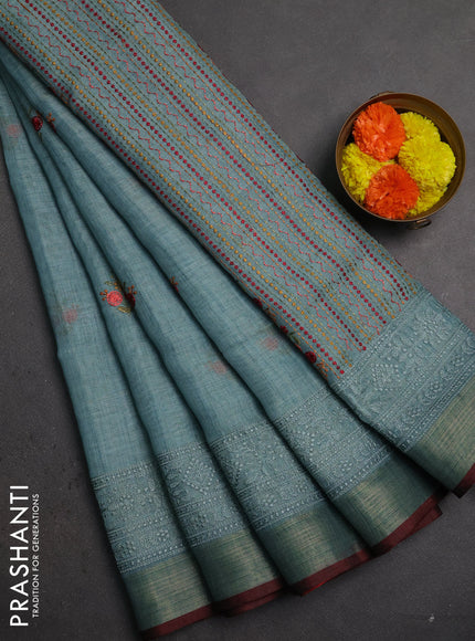 Linen saree pastel blue and maroon with embroidery buttas and embroidery pallu & border