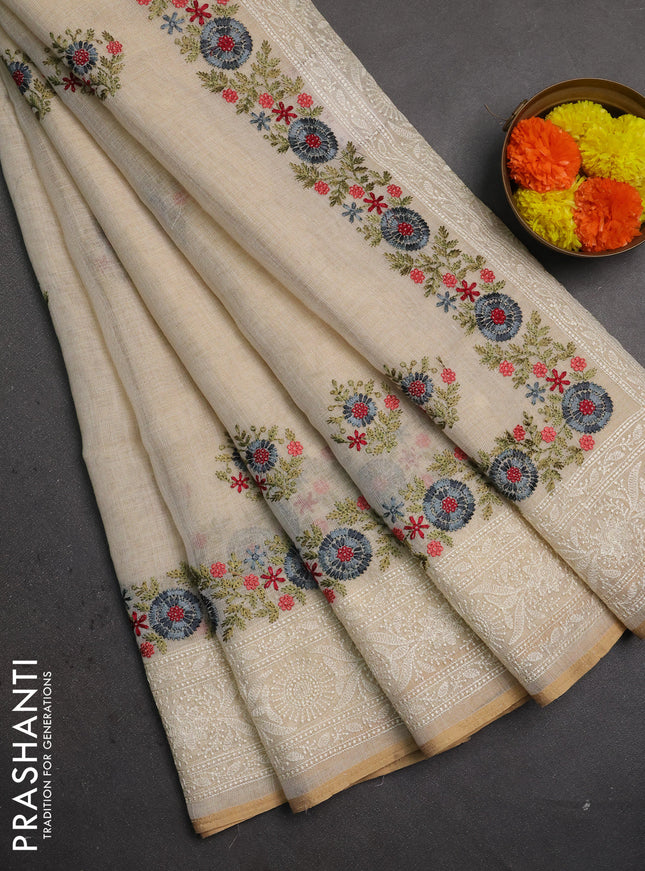 Linen saree beige with embroidery buttas and embroidery border