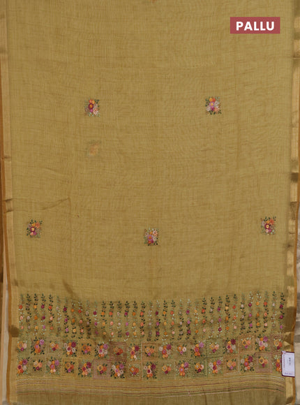 Linen saree mustard shade with embroidery buttas and embroidery pallu