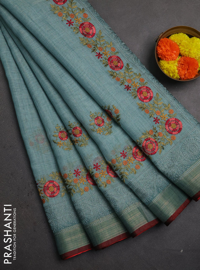 Linen saree teal blue and maroon with embroidery buttas and embroidery pallu & border