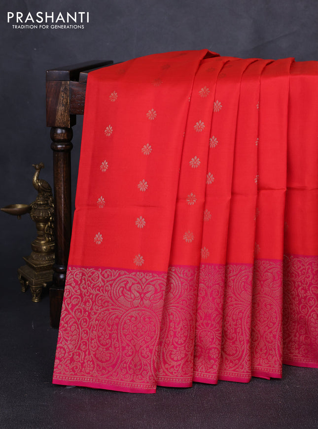 Kanchipuram soft silk saree reddish orange and pink with allover zari woven buttas and long zari woven border