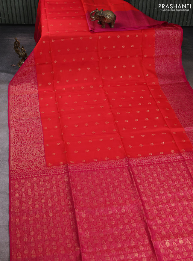 Kanchipuram soft silk saree reddish orange and pink with allover zari woven buttas and long zari woven border