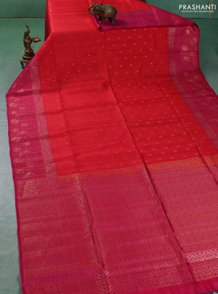 Kanchipuram soft silk saree reddish orange and pink with allover zari woven buttas and long zari woven border