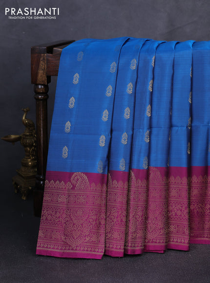 Kanchipuram soft silk saree peacock blue and dark magenta pink with allover zari woven buttas and long zari woven border
