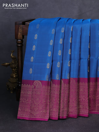 Kanchipuram soft silk saree peacock blue and dark magenta pink with allover zari woven buttas and long zari woven border