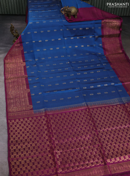 Kanchipuram soft silk saree peacock blue and dark magenta pink with allover zari woven buttas and long zari woven border