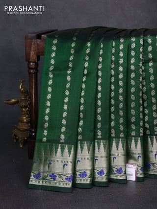 Venkatagiri silk saree bottle green with allover silver zari woven buttas and zari woven muniya butta border