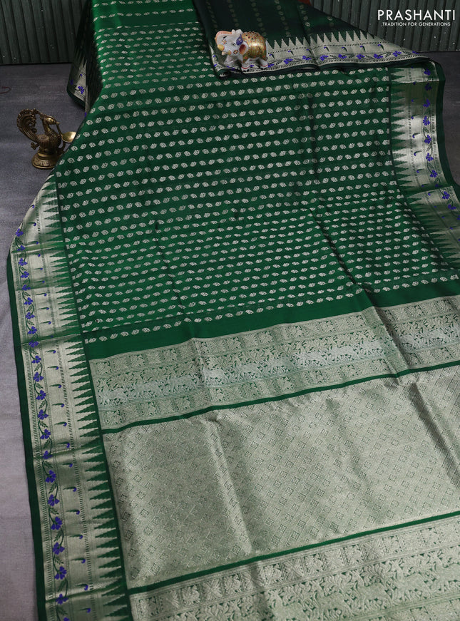 Venkatagiri silk saree bottle green with allover silver zari woven buttas and zari woven muniya butta border