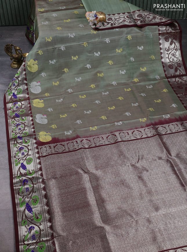 Venkatagiri silk saree pastel green and coffee brown with allover silver & zari woven buttas and peacock design zari woven border