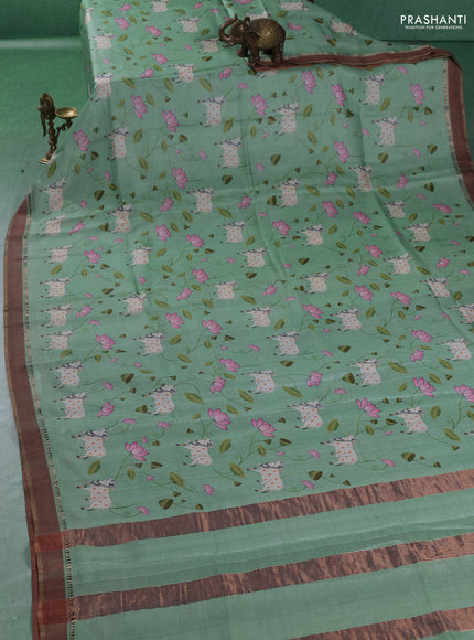 Pure tussar silk saree mild teal green with allover pichwai prints and woven border