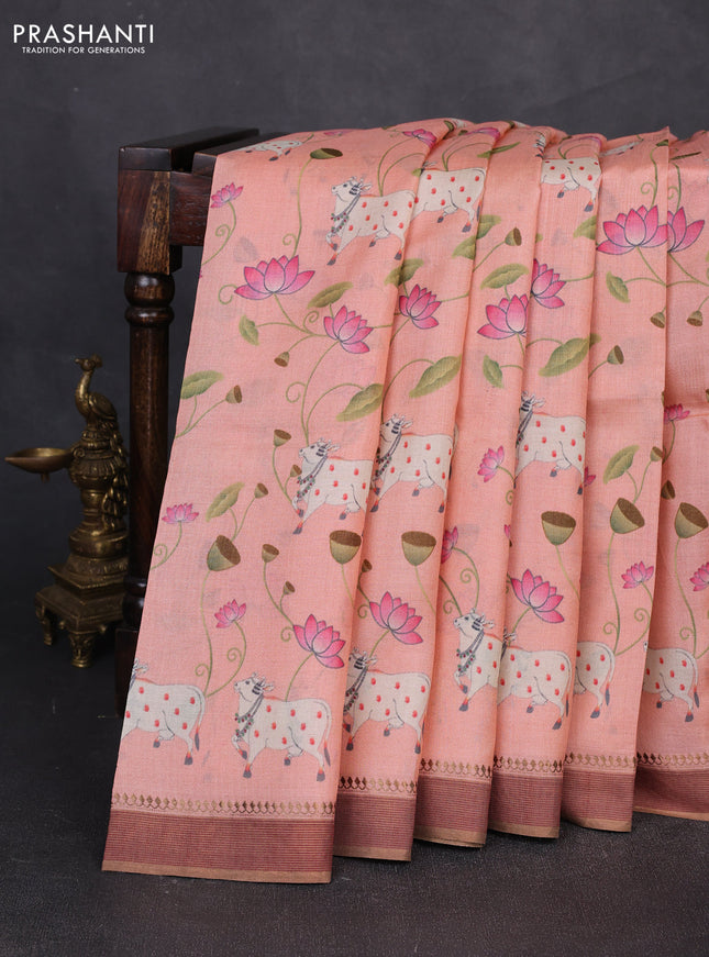 Pure tussar silk saree peach orange with allover pichwai prints and woven border