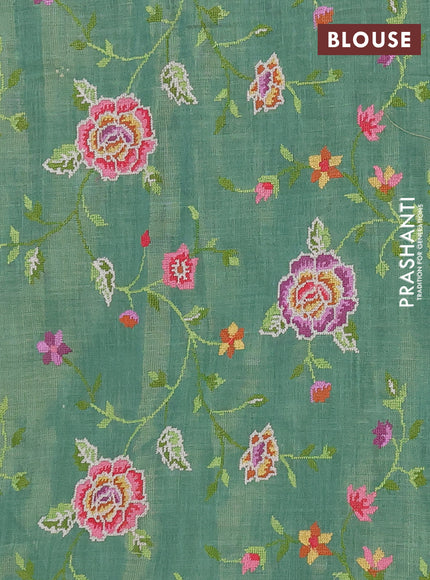 Art linen saree green with embroidery mirror work buttas and convent embroidery pallu