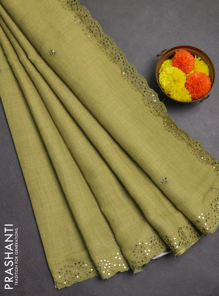 Art linen saree light green with embroidery mirror work buttas and convent embroidery pallu