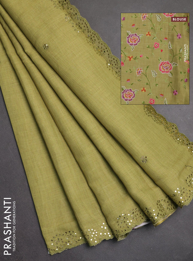 Art linen saree light green with embroidery mirror work buttas and convent embroidery pallu