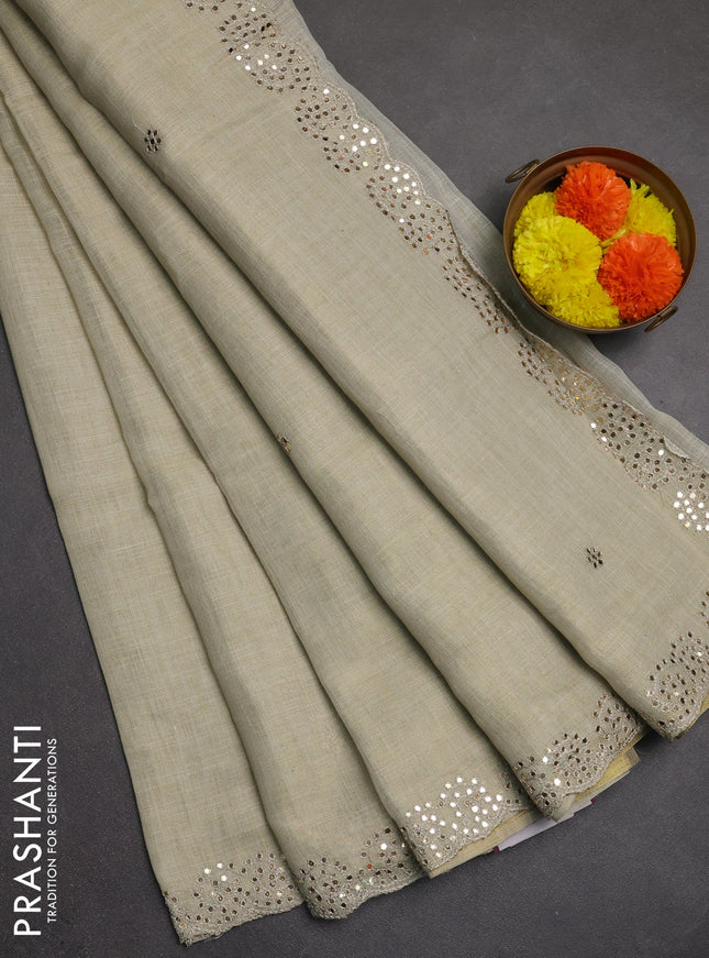 Art linen saree beige with embroidery mirror work buttas and convent embroidery pallu
