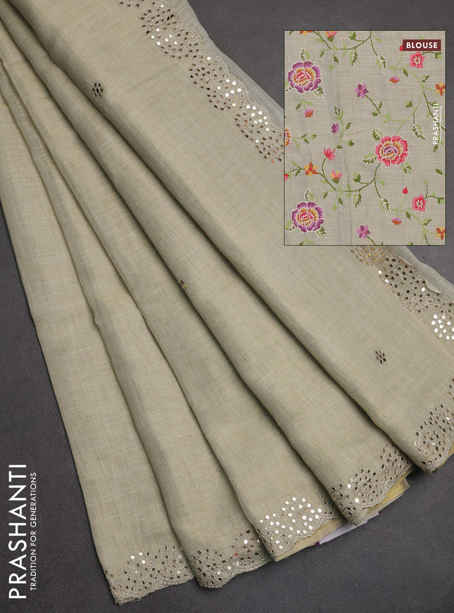 Art linen saree beige with embroidery mirror work buttas and convent embroidery pallu
