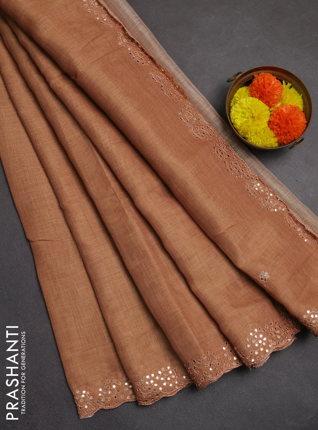 Art linen saree rust shade with embroidery mirror work buttas and convent embroidery pallu