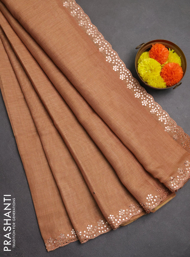 Art linen saree rust shade with embroidery mirror work buttas and convent embroidery pallu