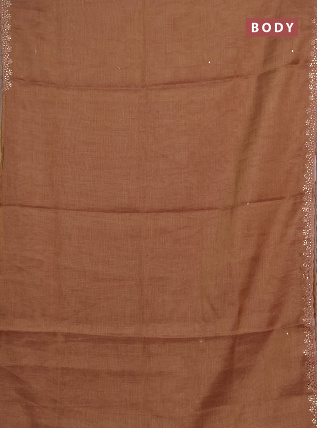 Art linen saree rust shade with embroidery mirror work buttas and convent embroidery pallu