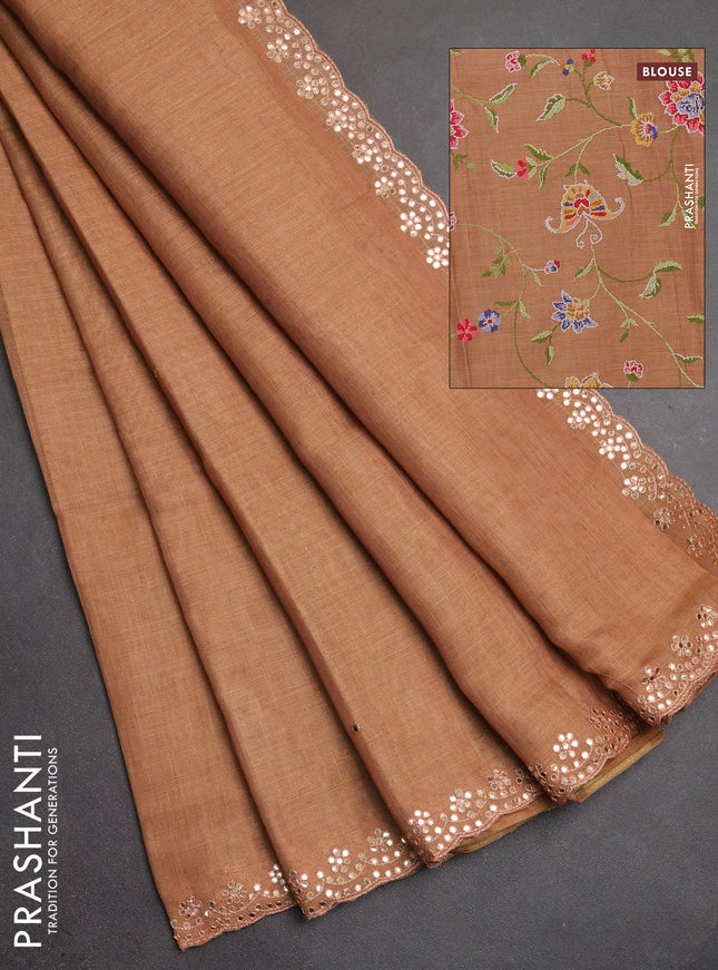 Art linen saree rust shade with embroidery mirror work buttas and convent embroidery pallu