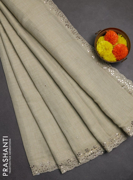 Art linen saree beige with embroidery mirror work buttas and convent embroidery pallu