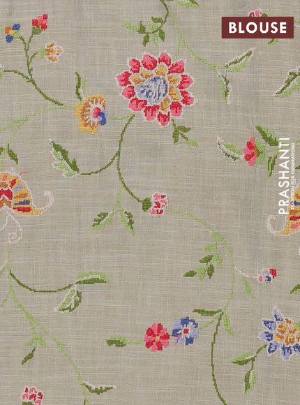 Art linen saree beige with embroidery mirror work buttas and convent embroidery pallu