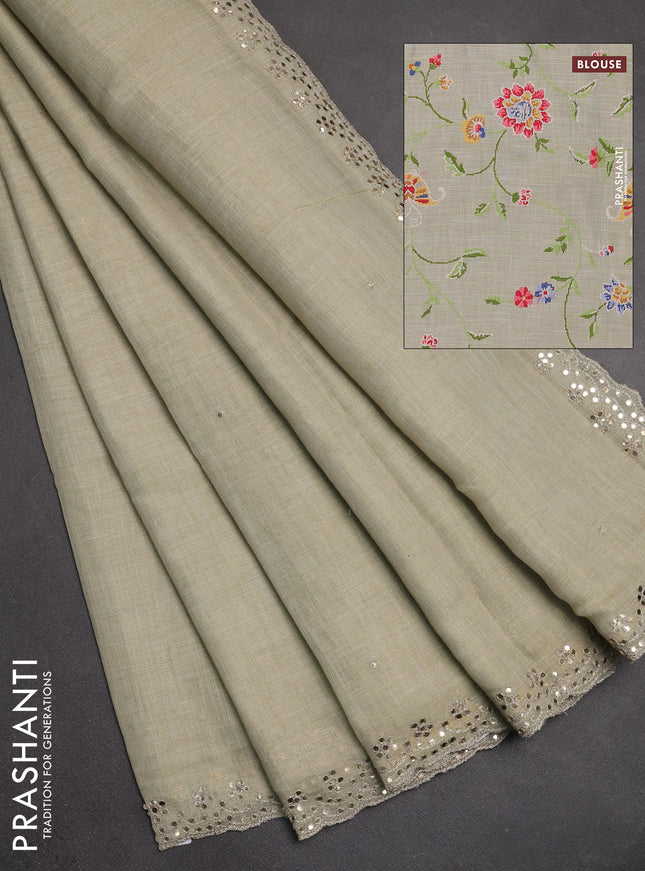 Art linen saree beige with embroidery mirror work buttas and convent embroidery pallu